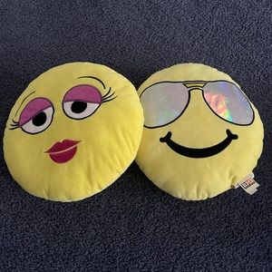 2 emoji pillows